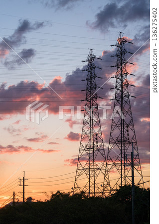 Power lines dyed in the sunset 136275402