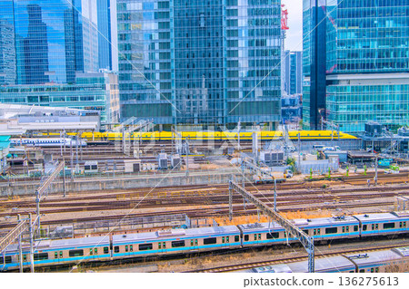 Tokyo cityscape in Japan. View of the Shinkansen bullet train Doctor Yellow, which brings good luck, Tokyo Station, trains, Yaesu and other buildings. 136275613