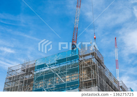 Blue sky and condominium construction site Blue sky and condominium construction site 136275725