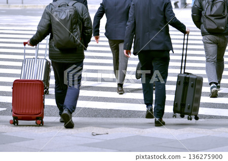 Tokyo cityscape in Japan. In front of Tokyo Station... Japanese businessmen crossing the crosswalk... Tokyo cityscape in Japan. In front of Tokyo Station... Japanese businessmen crossing the crosswalk... 136275900