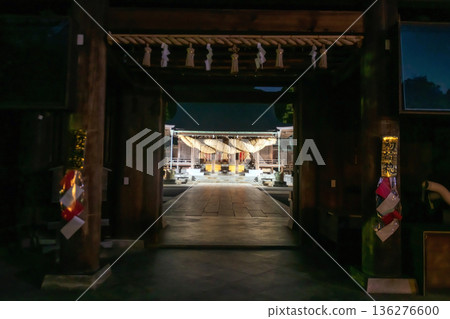 Entrance gate to Miyajidake Shrine with sacred rope at night 136276600
