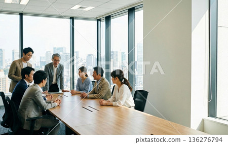Japanese business team having a meeting in a bright office (copy space on the right) Japanese business team having a meeting in a bright office (copy space on the right) 136276794