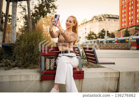 Young adult woman taking selfie with smartphone in Vienna, Austria 136276862