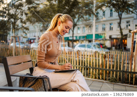 Young woman drawing on digital tablet in Vienna, Austria Young woman drawing on digital tablet in Vienna, Austria 136276869