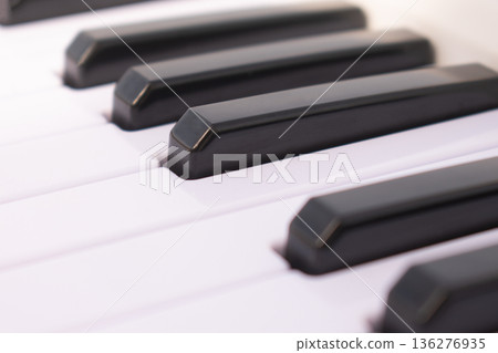 Macro view of piano keys on black background, close up musical instrument keyboard for classical concert poster, harmony and song composition concept 136276935