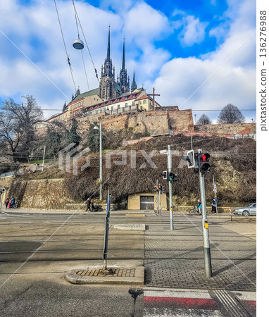 The Cathedral of St. Peter and Paul on Petrov hill in Brno, viewed from a city street with tram tracks. 136276988