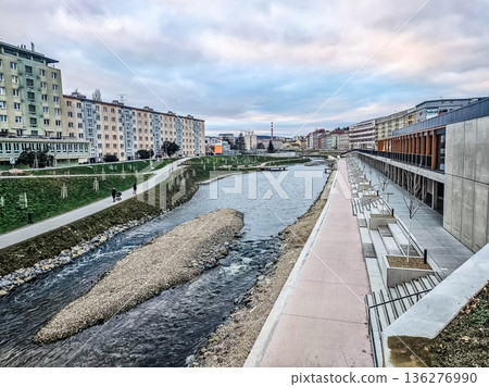 Revitalized waterfront of the Ostravice River in Ostrava, Czech Republic, with modern and old architecture. Revitalized waterfront of the Ostravice River in Ostrava, Czech Republic, with modern and old architecture. 136276990