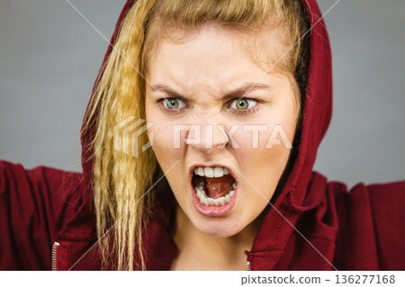 Angry sporty woman screaming Angry sporty woman screaming 136277168