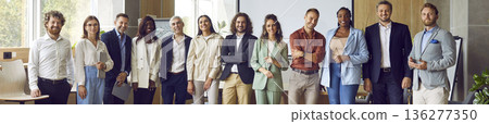Portrait of diverse business people standing on a meeting and looking at the camera. 136277350