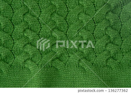 Green Cable Knitted Fabric woolen sweater background Green Cable Knitted Fabric woolen sweater background 136277362