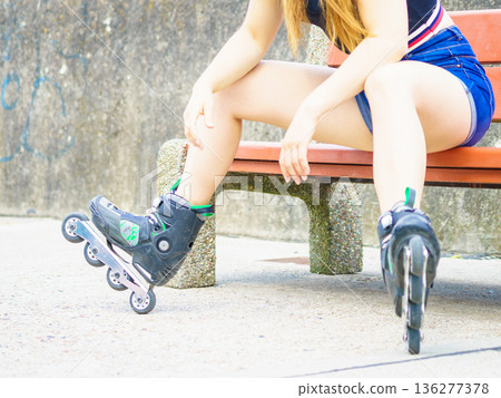 woman wearing roller skates woman wearing roller skates 136277378