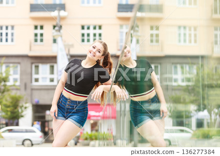Happy teenager woman outside. Happy teenager woman outside. 136277384