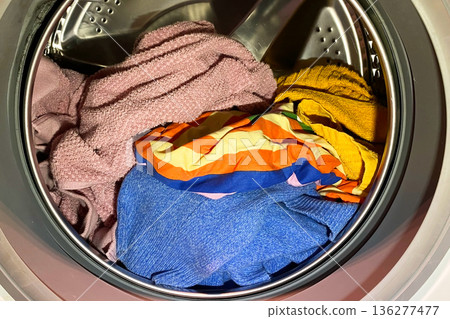 Colorful Laundry Inside a Washing Machine Drum Colorful Laundry Inside a Washing Machine Drum 136277477