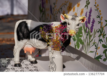 Cute figurines of cow made of clay, handmade. Crafts Fair. Travel souvenir. 136277704