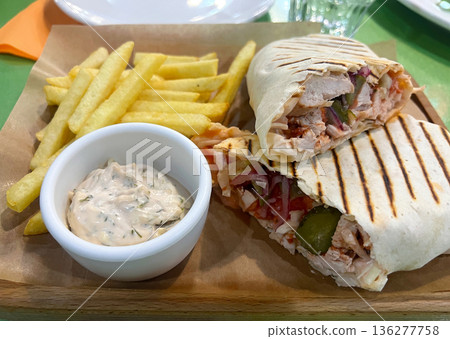 Shawarma with tartar sauce and French fries Shawarma with tartar sauce and French fries 136277758