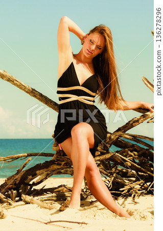 Woman nack pain beach. 136278296