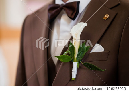 Brown Suit Wedding Groom Boutonniere White Calla Lily Bow Tie Formal Attire Elegant Event 136278923