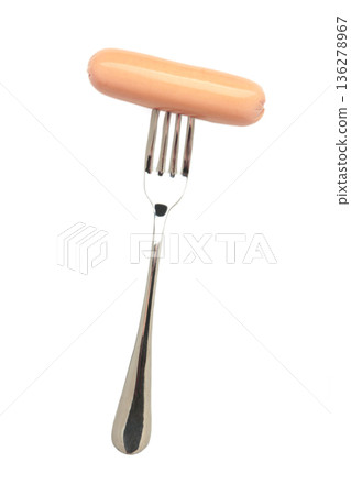 Tasty sausage on a fork isolated on white background 136278967