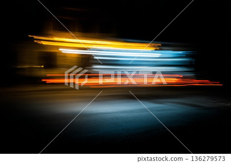 A blurry, fast-moving light, reminiscent of headlight trails on a city road, with a very long exposure and night lighting. The speed effect 136279573