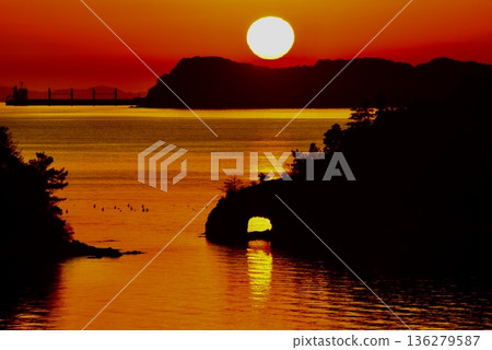 The sunset line from the cave at Yuhi Cape in winter The sunset line from the cave at Yuhi Cape in winter 136279587