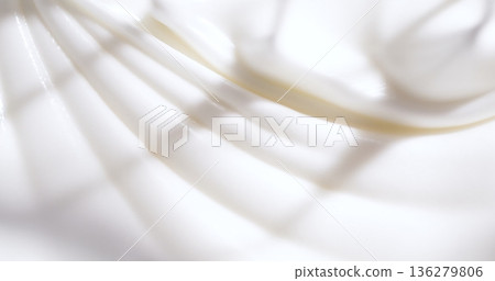 Swirling white liquid combines with soft shadows on a smooth surface in a bright kitchen Swirling white liquid combines with soft shadows on a smooth surface in a bright kitchen 136279806