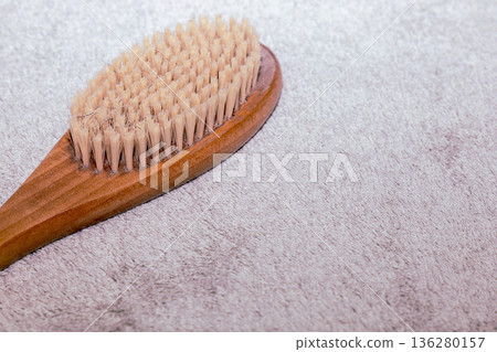 Natural bath accessories on light green towel. 136280157