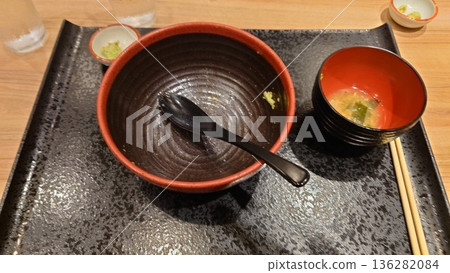 A bowl of rice and a bowl of miso soup after the meal is finished A bowl of rice and a bowl of miso soup after the meal is finished 136282084