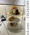 A luxurious three-tiered afternoon tea set 136282089