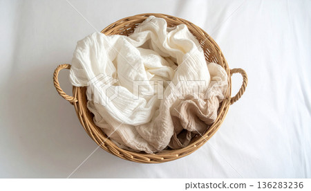 Natural background of white cloth and basket wrapped in natural light Natural background of white cloth and basket wrapped in natural light 136283236