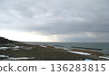 Snow-covered coastline and the Sea of Japan bathed in winter sunlight 136283815