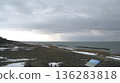 Snow-covered coastline and the Sea of Japan bathed in winter sunlight 136283818