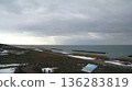 Snow-covered coastline and the Sea of Japan bathed in winter sunlight 136283819