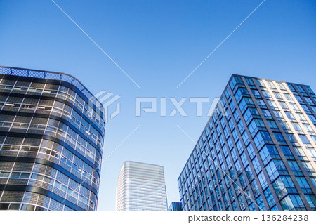 Landscape of the office town looking up at a skyscraper Landscape of the office town looking up at a skyscraper 136284238