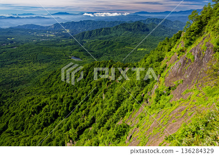 Kagami Pond and the mountain ranges of Mt. Fuji, Yatsugatake, the Southern Alps, and the Central Alps seen from Mt. Togakushi 136284329