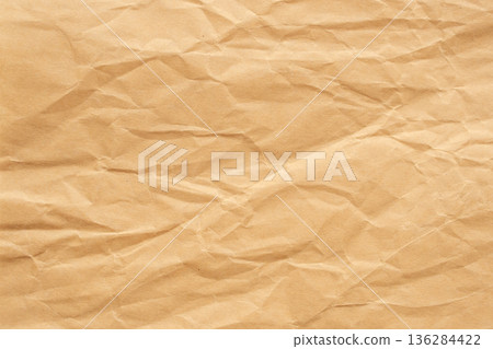 Abstract crumpled and creased recycle brown paper texture background Abstract crumpled and creased recycle brown paper texture background 136284422