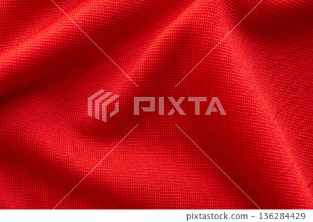 Red sports clothing fabric football shirt jersey texture close up 136284429