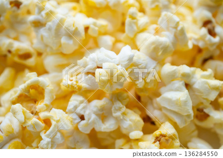 Tasty popcorn close up background top view Tasty popcorn close up background top view 136284550