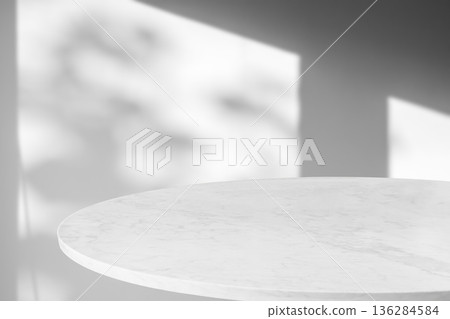 Round marble table top with tree leaves shadow drop on white wall background for mockup product display 136284584