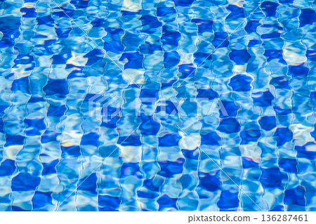 Blue Swimming Pool Water Texture with Ripples and Tiles 136287461