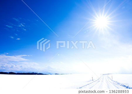 A packed snow icy road scene in Biei, Hokkaido, under the winter sun and blue sky A packed snow icy road scene in Biei, Hokkaido, under the winter sun and blue sky 136288933