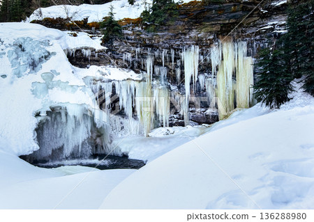 Frozen Mountain Waterfalls in Serene Winter Landscape Frozen Mountain Waterfalls in Serene Winter Landscape 136288980