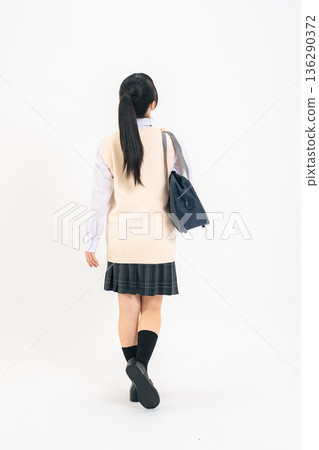 Full-body photo of a female student in a walking uniform Full-body photo of a female student in a walking uniform 136290372