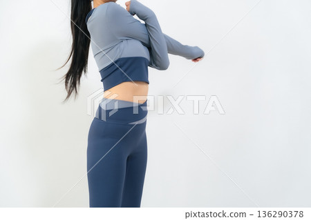 Women in sportswear to stretch Women in sportswear to stretch 136290378