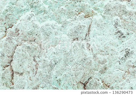 Faded light gray-gray to aqua green rock texture with brown cracks Faded light gray-gray to aqua green rock texture with brown cracks 136290473