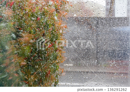 Water drops of rain on a window glass Water drops of rain on a window glass 136291262