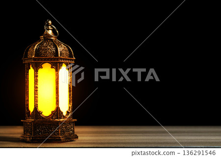 Golden Arabic Lantern with Warm Glow on Wooden Table Against Black Background. Ramadan and Eid Mubarak Concept. High quality photo 136291546
