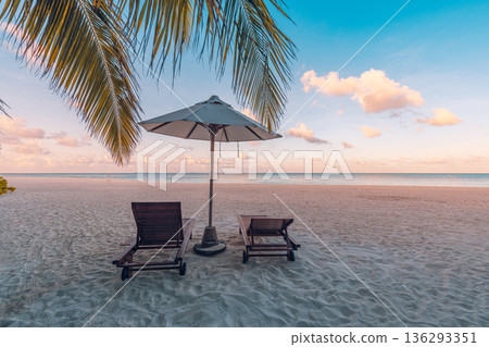 Romantic honeymoon anniversary beach vacation background. Sunset ocean palm trees sandy shore view 136293351