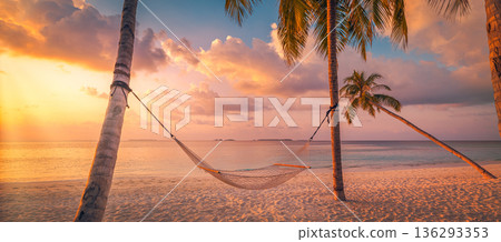 Carefree hammock swing at Maldives sunset. A peaceful retreat for a relaxed luxury honeymoon 136293353