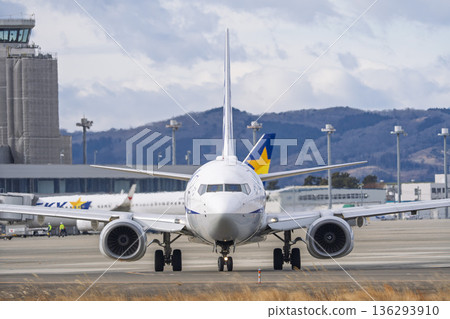 Sendai Airport in winter, airplane taxiing, Natori City, Miyagi Prefecture 136293910