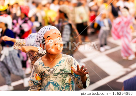 Summer festival, boy dancing wearing a Hyottoko mask 136294893